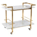 Gold and white bar cart with marble surfaces