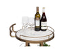 Round marble drink cart holding wine bottles and wine glasses