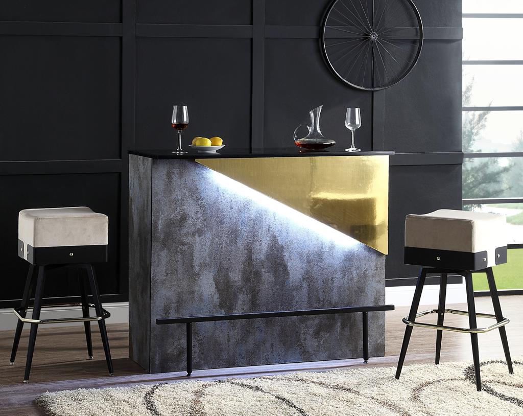 Sophisticated grey and gold bar counter in a dark bar setting